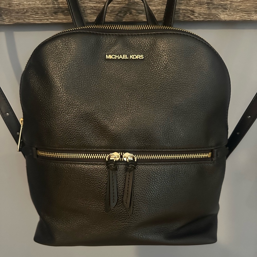 Michael Kors Black Backpack with Gold Zipper.